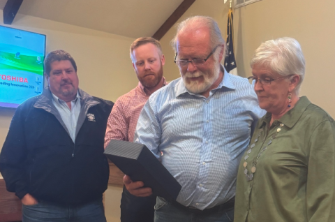 Pictured above (from left to right): Commissioners Joey Dorsey, Jeff Brown and Marshall Sayer present retiring county clerk Lawana Kahn with a plaque commemorating her four decades of service. 