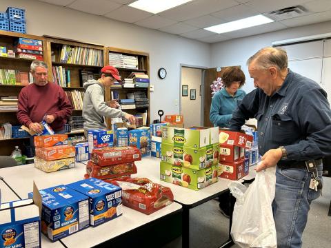 As an integral component of Friday Backpack, operated by Hart Partners, community volunteers gather each week at agency’s downtown office to fill bags with shelf-stable food to be delivered to North Hart, South Hart and Hartwell elementary school students who are referred to the program. Filling the bags are, from left: Greg Blatt, Hubble Kay, Lori Blatt and John Mead.