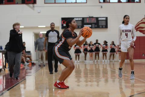 Senior guard TK Smith hits a three from the right corner in the 79-26 loss against Hebron.   