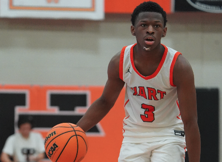 Senior guard Andrew Maxwell brings the ball up the court in a 75-67 overtime thrilling win over Franklin County. Photo submitted by DJ Groves.