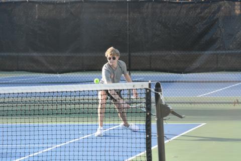 Senior Ayden Mercer returns the serve in a match earlier in the season, as he helped propel Hart County to a 3-1 win over East Jackson with a 7-5, 6-2 win at No. 1 doubles in the first round of the region tournament on April 15. (Photo/Benjamin London)