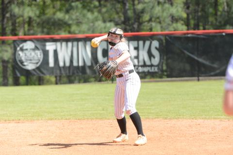 Sophomore infielder Carly Dutton throws to first for the out in the 12-8 win over Cherokee. (Photo/Benjamin London)
