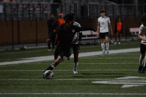 Jose Mendez sneaks in a goal in the historic 3-0 win over the Indians of Stephens County on March 21. (Photo/Benjamin London)