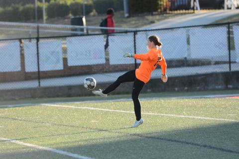Goalkeeper Kaylin Bowers punts the ball away after a save in the 8-0 loss to Stephens County on March 21. (Photo/Benjamin London)