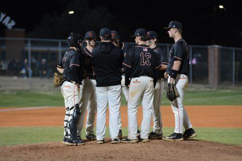 The pitcher, the infielders and head coach Hunter Barton gather at the mound as the Diamond Dogs fall into an eight-game losing streak and seven-game losing streak in region play. (Photo/Benjamin London)
