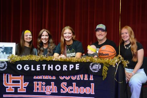 Pictured is Channing Segars (third from left) alongside her family after signing with the Stormy Petrels of Oglethorpe University on March 25 from the Lonnie Burns Fine Arts Center on the campus of Hart County High School. (Photo/Benjamin London)