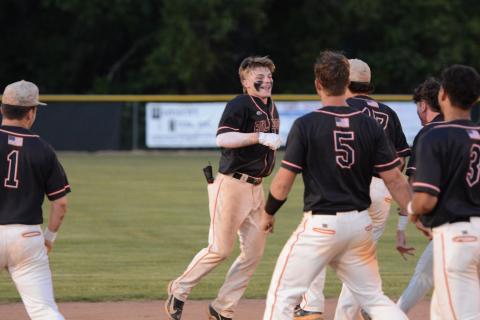 Freshman infielder Slate Osborne (left) walks it off in the 4-3 win in game two on April 25. (Photo/Benjamin London)