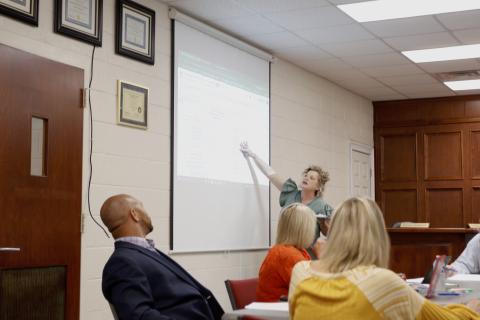 Superintendant Jennifer Carter pointing to a Fiscal Year 2026 tentative budget spreadsheet at Tuesday's budget work session. The Board of Education anticipates a projected $3.2 million total increase from the previous year’s budget. (Photo/Adriana Cascio)