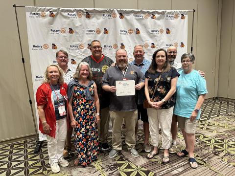 The club was named the District 6910 2024-2025 Club of the Year Runner-Up. Club members pictured with the award include (front row, L-R) Joni Ingram, Debbie Kulcsar, Jason Ford, Rebecca Metzger and Nancy Butler; (back row, L-R) Jeff Loggins, Georgia District Governor Bobby Hildreth, Mike Everett and Brian Metzger. (Photo submitted by Rotary Club of Hartwell)