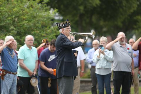 American Legion Post 109 held its annual Memorial Day ceremony Monday, May 26 at the Hart County Courthouse. Above, U.S. Air Force veteran Phil Stocks plays Taps outside the courthouse as attendees and fellow retired service men and women salute. (Photo by Rose Scoggins - Editor/Publisher)