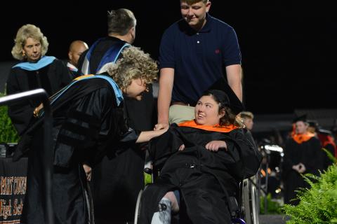 Superintendent Jennifer Carter (left) and Trinity Smith (right) exchange smiles after Smith received her diploma from Hart County High School Principal Kevin Gaines during the Hart County Charter System’s annual commencement ceremony Friday, May 23. See more photos from graduation on page 16A. (Photo/Benjamin London)