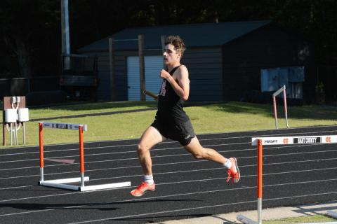 Senior Nate Harris qualifies for state after placing second in the 4x800-meter relay and third in the 800-meter run and the 1600-meter run at Sectionals on May 3. (Photo/Benjamin London)