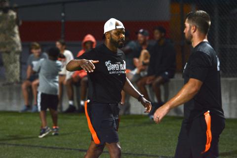 Kendrick Harper (left) celebrates with a teammate after scoring his second receiving touchdown in the 39-35 win over Team Odd in the Harper Island Alumni Game.  (Photo/Benjamin London)