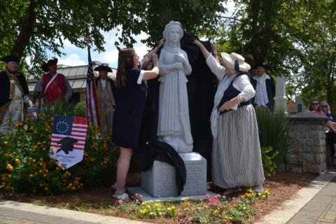Members of the John Benson Chapter of the Daughters of the American Revolution and local historian and Nancy Hart impersonator Sara Lesseur unveiled the new Nancy Hart statue on June 18. (Photo/Adriana Cascio)