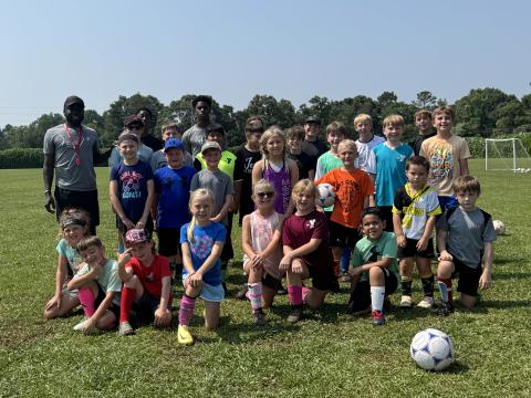 The Bell Family YMCA of Hartwell hosted more than 35 campers during their annual FUNdamental soccer camp June 2-6. Campers learned the fundamentals of soccer -- passing, dribbling and shooting, while others grew a love for the game. Pictured is all of the campers who attended with YMCA’s sports director Kerv Augustin (pictured on the back row to the left). (Photo/Adriana Cascio)