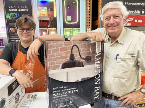 When I needed help choosing light fixtures, Alex Howard—wearing an orange apron—walked up. I was surprised that he was Hubert Howard’s great-grandson. And Alex was surprised that I knew so much about his family. Hubert had been my boyhood Sunday school teacher and later my attorney for decades. (Photo submitted by Dink NeSmith)