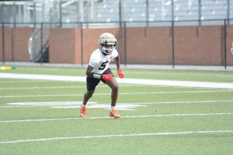 Rising senior receiver CJ Cowins runs a route during a summer practice. (Photo/Benjamin London)