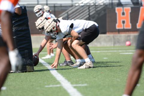 Rising senior left tackle Chris Collins lines up before the snap during a summer practice. (Photo/Benjamin London)