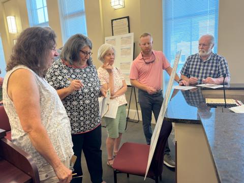 During the City of Hartwell’s Comprehensive Plan meeting Monday, members of the public including (L-R) Tamyra Hyatt, Rita Smith, Rita Chapman and commissioners Jeff Brown and Marshall Sayer study the public comment form before crafting their input. Results from the comments will be discussed during the final meeting Aug. 12 at 4 p.m.  (Photo/Adriana Cascio)