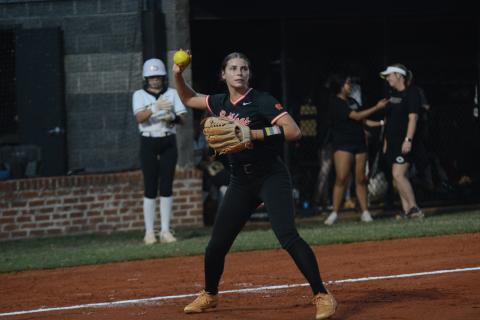 Madi Bennett fields a blunt before throwing the runner out at first during a fast-pitch game in 2024. (Photo/Benjamin London)