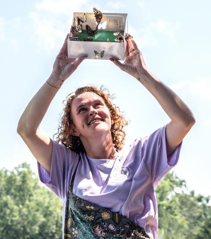 Big Hart Farm owner Maggie Jackson releases butterflies from a box during one of the farm’s many events July 5. (Photo/Bill Powell)