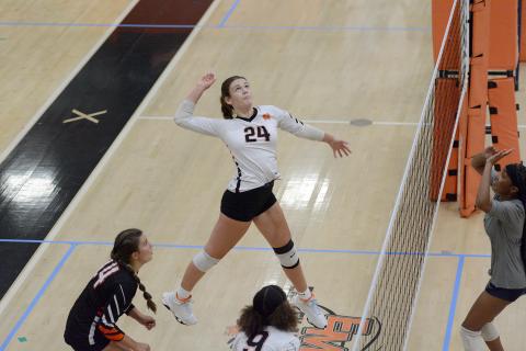 Sophomore Coley Phillips goes for the kill during a home match earlier in the season. (Photo by Benjamin London)