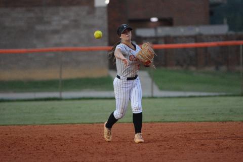 Sophomore infielder Emory McCollum fields a grounder then throws to first for the out in the 8-0 loss to Jackson. (Photo by London)