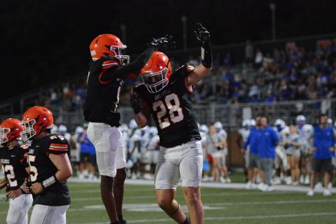 Senior tight end Boston Graham (right) celebrates with senior wide receiver CJ Cowins (left) after the touchdown in the 28-6 win over the Warriors of Oconee County in a scrimmage Aug. 8.  (Photo by London)