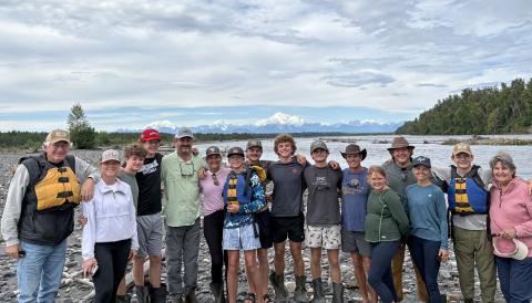 One of the highlights of the 10-day Alaska adventure was rafting down the Chulitna River in Talkeetna and getting a rare view of North America’s tallest mountain, unobstructed by clouds. With Denali, aka Mount McKinley, in the background are, from left, Dink NeSmith, Heather NeSmith, William NeSmith, Fenn NeSmith, Alan NeSmith, Emily N. Wilson, Smith Wilson, Wyatt Wilson, Henry Wilson, Hayes Wilson, Tom Wilson, Stella NeSmith, Eric NeSmith, Connell NeSmith, Bayard NeSmith and Pam NeSmith. (SubmittedNeSmith)