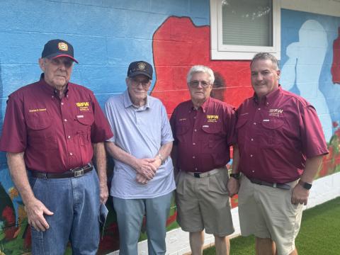VFW Post 8076 members (L-R) Charles Howard, Jack Eagan, Herb Hicks and Eric McAllister pose in front of the “Buddy Poppy” mural on the renovated VFW building, located at 173 Ack Powell Road. Most renovations were done by VFW members, volunteers and help from local organizations, such as Golden K, Turner Concrete and Dennis Holland Heating Air and Electrical. (Photo by Adriana Cascio)