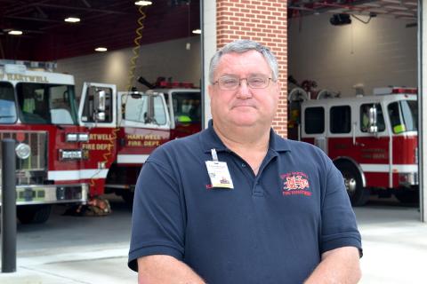 Fire Chief Alan Daniel poses in front of the Hartwell Fire Department, located at 456 E. Howell St., on Tuesday. Daniel is recognized this week as a hero of Hart County for his 41 years of service to the community. (Photo by Adriana Cascio)