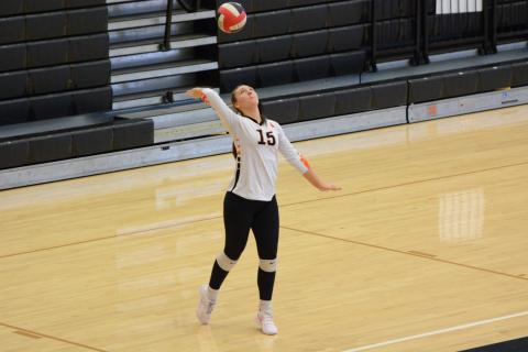 Senior middle Ashlyn Wicker serves the ball into play during their 2-0 win on the road against Prince Avenue Sept. 18. (Photo by Benjamin London)