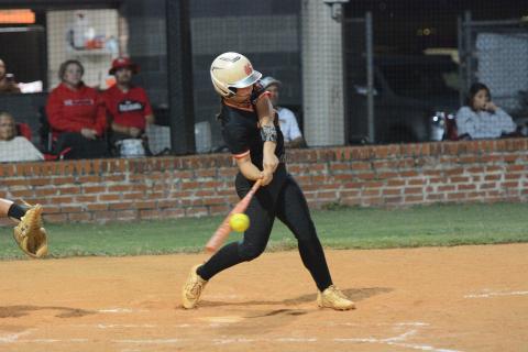 Sophomore infielder Emory McCollum hits a sacrifice fly in the bottom of the seventh inning to score a run as the Lady Dogs fell just shy of completing the comeback over the Lady Indians of Stephens County Sept. 9, 4-3. (Photo by Benjamin London)