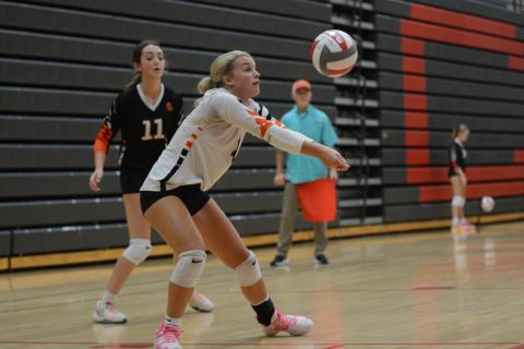 Senior libero Erin Miller sets the ball during the 2-1 win over Madison County Aug. 28. (Photo by Benjamin London)