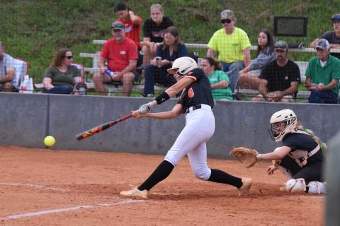 Senior infielder Madi Bennett collects a hit as she went 2-4 with a run and a run batted in against Franklin Aug. 28.  (Photo by Shane Scoggins)