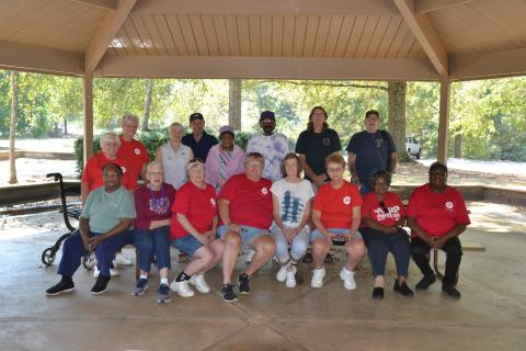 AARP Chapter #2006 members (front row, L-R) Ida Hartland, Mary Lewis, Sandy Mariacher, Deb Caudle, Nancy Sturm, Vonda Smith, Ophelia Craft and Milli Teasley; (back row, L-R) Claire Bramlette, Jan Doten, Bonnie Fracy, Rick Fracy, Alice Worthan, Al Burch, Steve Brown and Hand Sturm gather for the group’s annual picnic on Sept. 17. With 35 members, the chapter is the only AARP within the Northeast region, and it primarily serves the people of Hart and Franklin counties. (Photo by Adriana Cascio) 