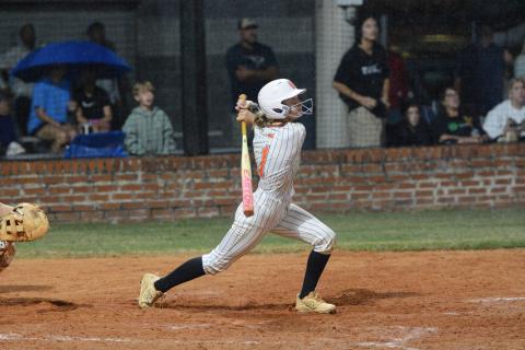 Freshman designated hitter Chloie Lack singles on a fly ball to left field to score the game winning run in the ninth inning to help the Lady Dogs capture a 6-5 win over the Lady Lions of Franklin County Sept. 29. (Photo by Benjamin London)