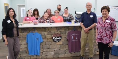 The staff at the Northeast Georgia Animal Shelter – pictured with board members Michelle Branton, John McGarity and Pam Stone – stand in the lobby of the new adoption building. The staff is available to help those looking to adopt a new dog or cat. (Photo by Shane Scoggins)