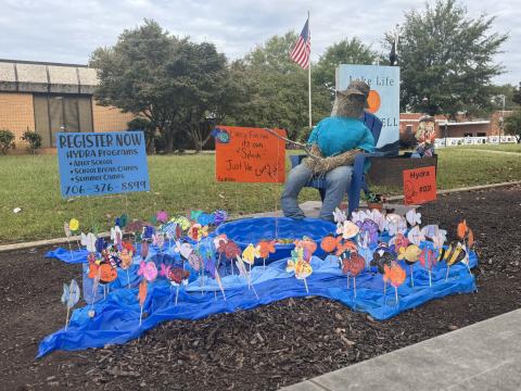 Scarecrows, like the one from HYDRA, have begun to pop up all over town. Voting for the People’s Choice Award is open through Oct. 29. Ballots can be found on page 2 of this week’s paper. (Photo by Adriana Cascio)