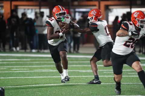 Photo by Ric Williams Junior quarterback Kurston Curry hands the ball off to junior running back Faustino Rangel who rushed for just shy of 200 yards and scored three rushing touchdowns in the 31-20 loss to Appling County Nov. 14.