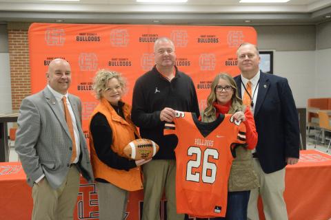 Pictured from left is assistant superintendent Brooks Mewborn, superintendent Jennifer Carter, new HCHS head football coach Biff Parson, chair of the board of education Kim Pierce and principal of HCHS Kevin Gaines at the introductory press conference Jan. 15. Photo by Benjamin London.