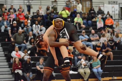 Junior Champ Blackwell goes to flip over his opponent as he ended up pinning his opponent to help the Mat Dogs capture a 73-6 win over Stephens County on senior night Jan. 6. Photo by Benjamin London.