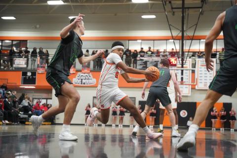 Boys basketball’s senior forward Riyan Partlow earns Athlete of the Week. Photo by Ric Williams.