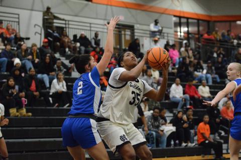 Sophomore forward Sarai Shealer drops 19 points to lead the team in scoring in the 59-47 loss to Oconee County in the McDonald’s Shootout Championship Game Dec. 30. Photo by Benjamin London. 