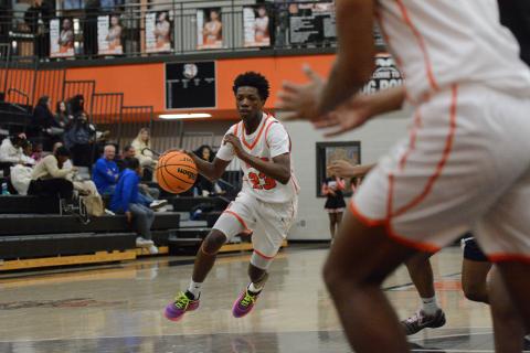 Sophomore guard Terrion Rucker drives to the rim, as he led the team with 17 points in the 57-55 loss to the Lions of Luella Dec. 30. Photo by Benjamin London. 