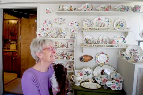 Brenda Spears, with her dog, Petey, remembers the life of her late husband, Buddy, through their mutual love of pottery and antiques. Photo by Madison Linton.