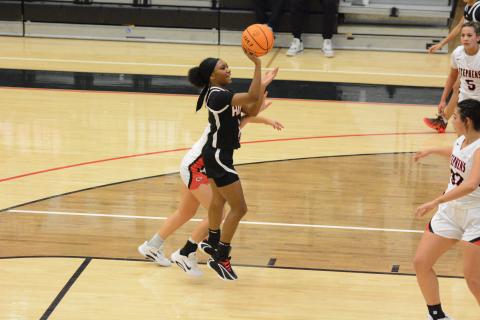 Junior guard Jaycee Wiley puts up a floater in the 63-33 win at Stephens County Feb. 10. Photo by Benjamin London. 