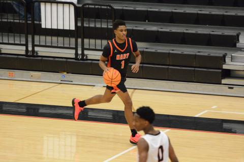 Junior guard Kurston Curry brings the ball up the floor in the 83-52 win over Stephens County in Toccoa Feb. 10. Photo by Benjamin London. 