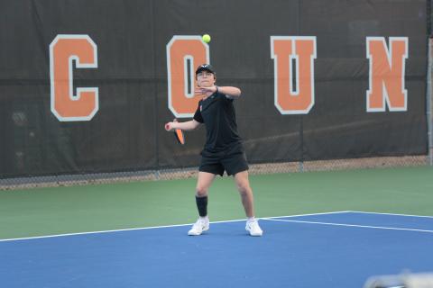 Riley Gaines returns a serve in the 5-0 win against Elbert County Feb. 9, as he remaines undefeated through three matches at No. 3 singles. Photo by Benjamin London. 