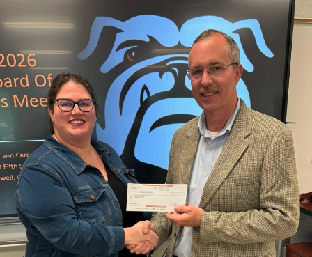 Georgia Power's Kevin McCraney (right) presents a donation to Hart County Chamber of Commerce President and CEO Amanda Brown (left) to fund the first year of a Georgia Foundational Leadership and Entrepreneurial X-Perience (FLEX) Program at the Hart County College and Career Academy. Photo submitted by the Hart County Chamber of Commerce.